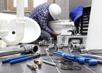 Plumber At Work In A Bathroom, Plumbing Repair Service, Assemble And Install Concept